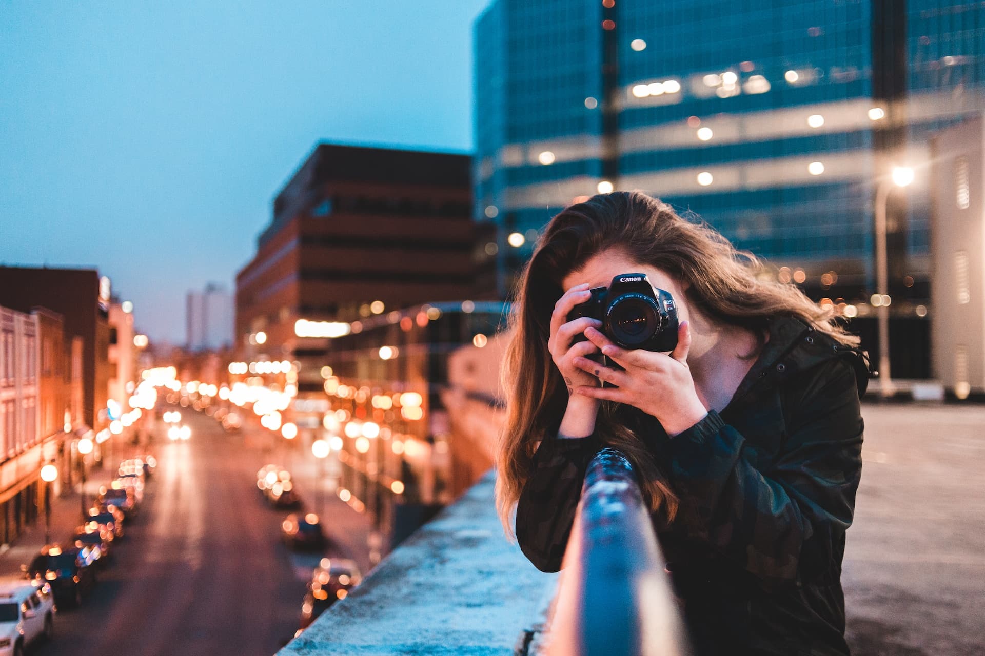 Jo Smith taking a photo on top of a building